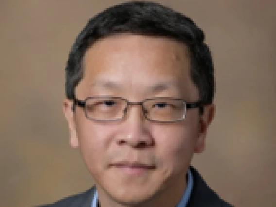 Man with glasses wearing a suit